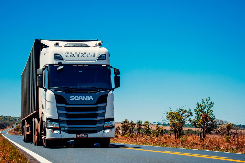 Freight truck traveling along a highway